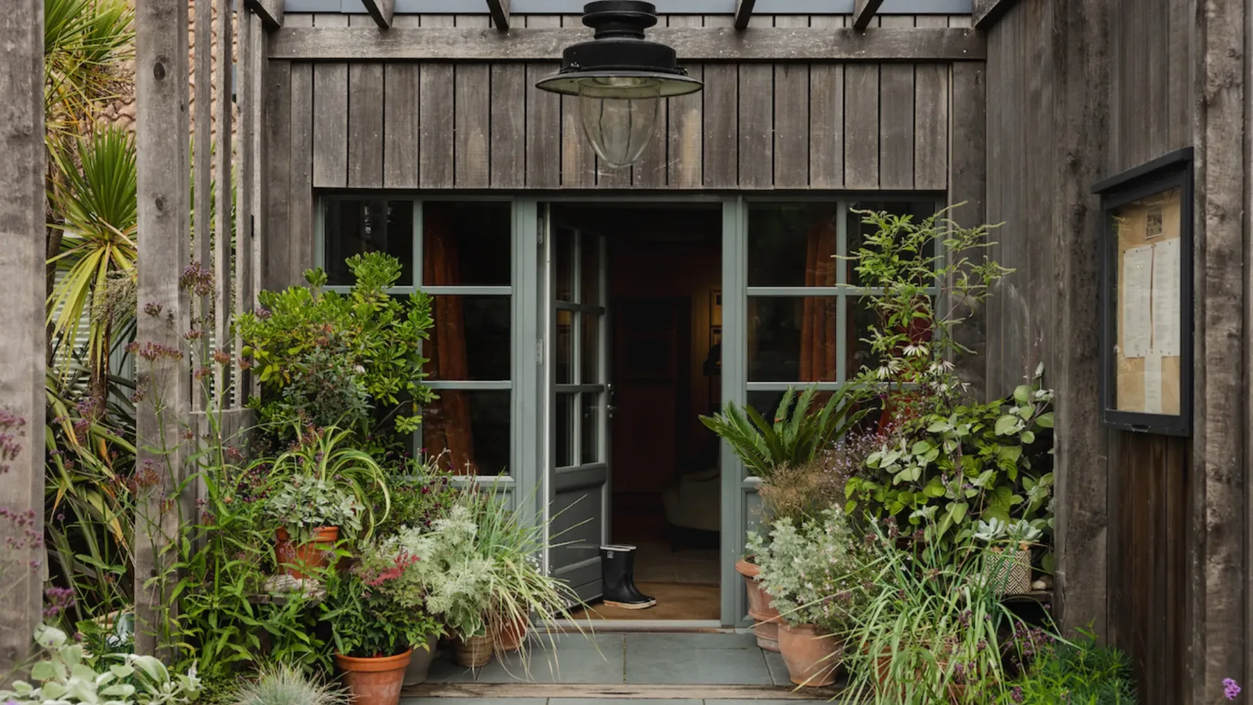The Gallivant’s timber-clad entrance, with the doors open and planting either side